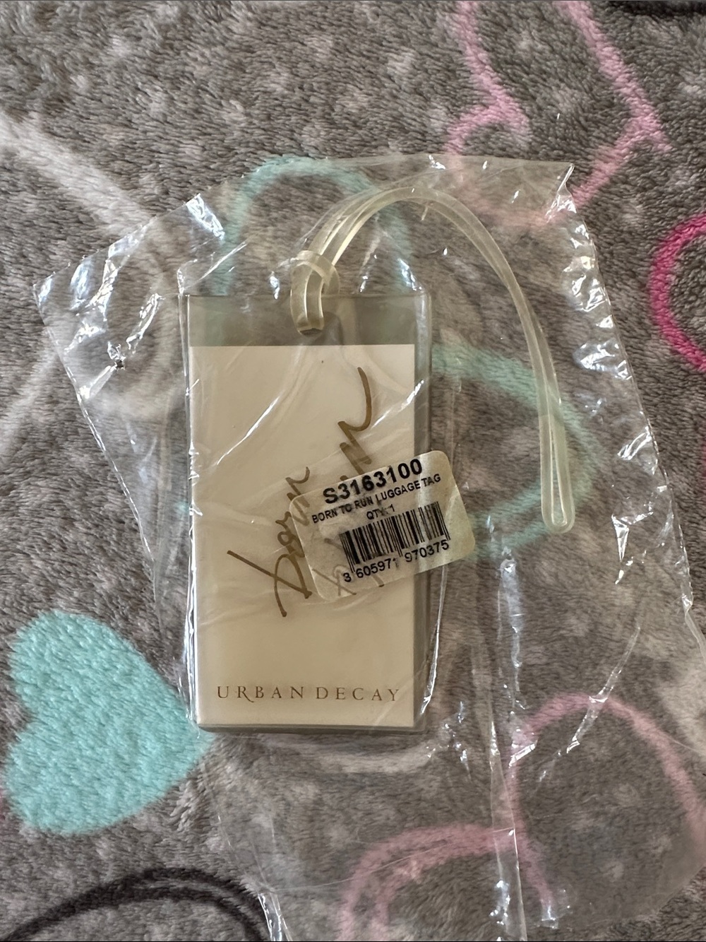 Urban Decay Clear Luggage Tag with Gold Script and Cream Insert